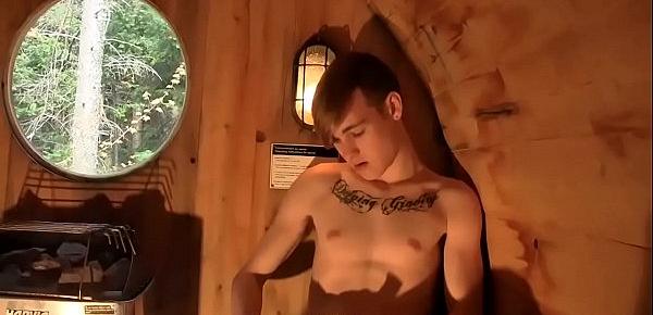  Blonde tattooed twink rides a dildo and jerks off in a sauna